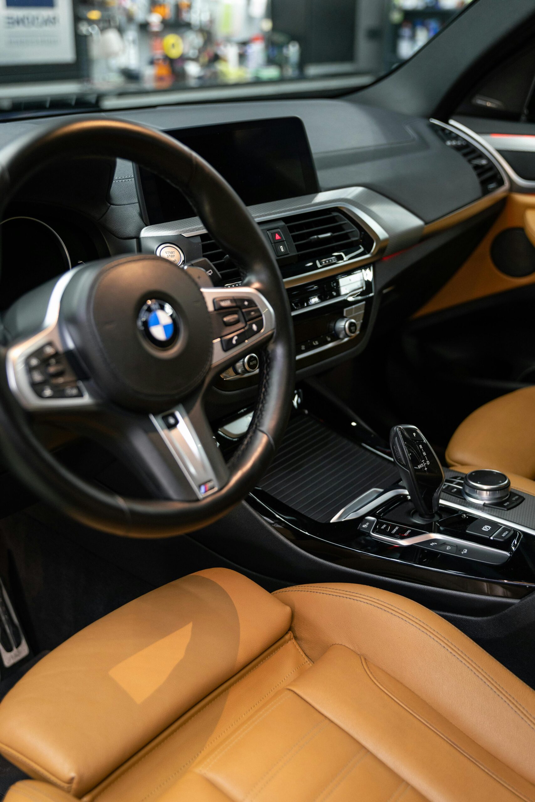 Explore the modern and luxurious interior of a BMW with leather seats and advanced dashboard controls.